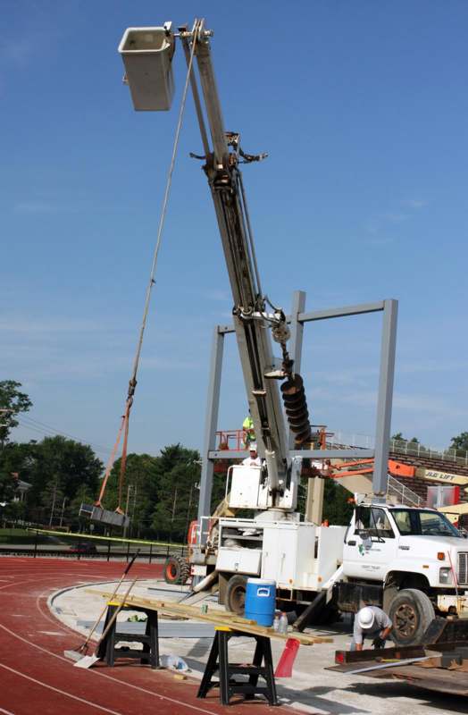 a crane lifting a metal frame