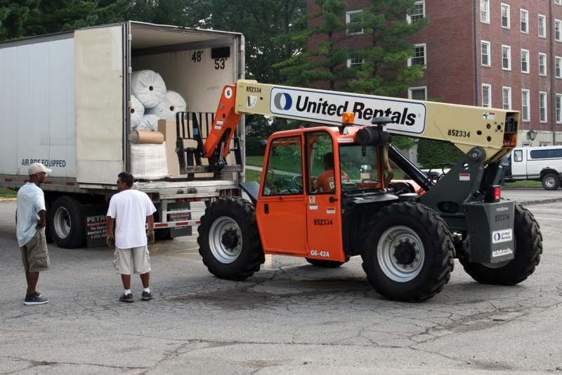 a forklift loading a truck