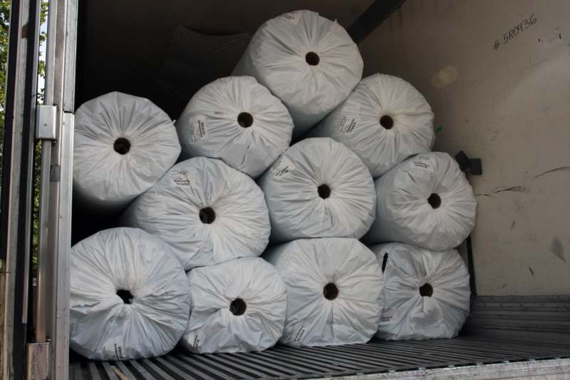 a stack of large white rolls of paper
