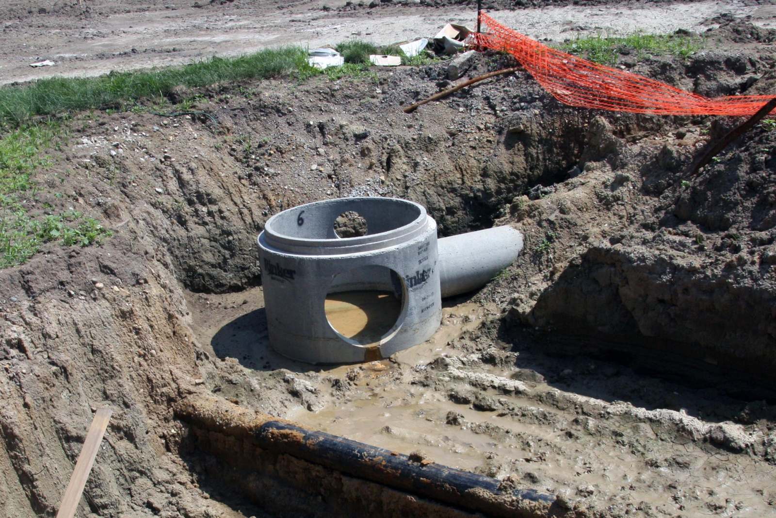 a concrete pipe in the dirt