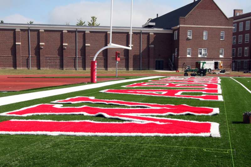 a football field with red and white letters