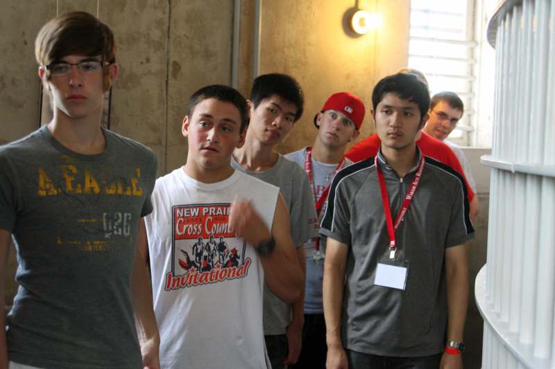 a group of young men standing in a room