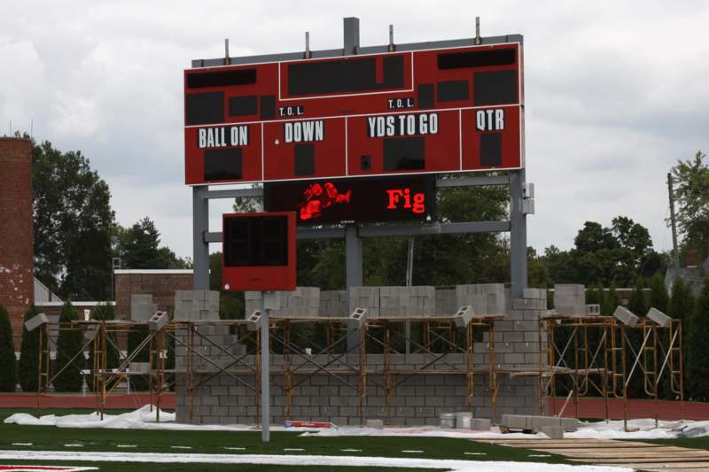 a scoreboard on a football field