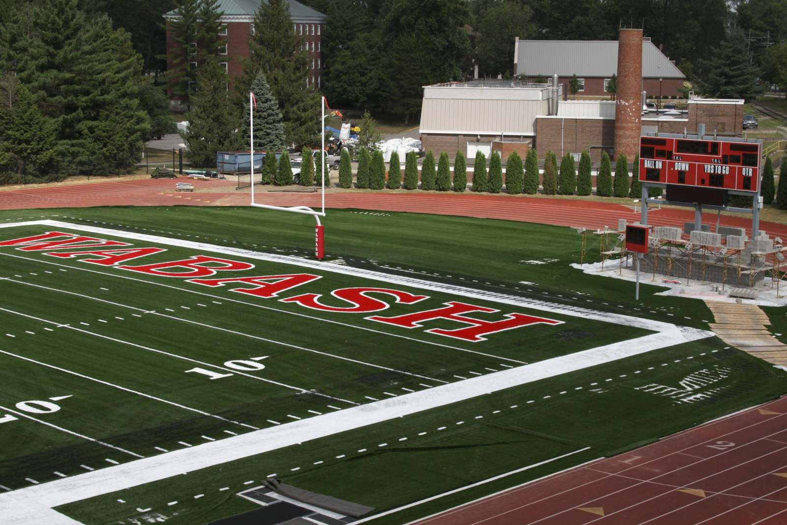 a football field with a red and white logo