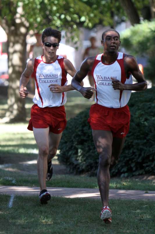 a pair of men running