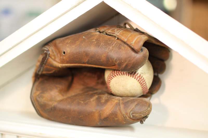 a glove and baseball in a house