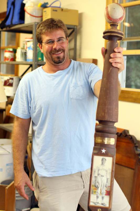 a man holding a wooden object