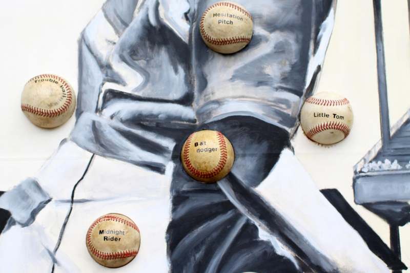 a group of baseballs on a painting