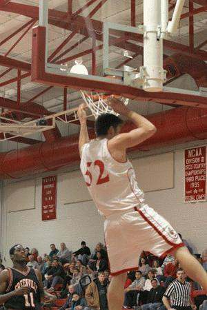 a basketball player dunking a basketball