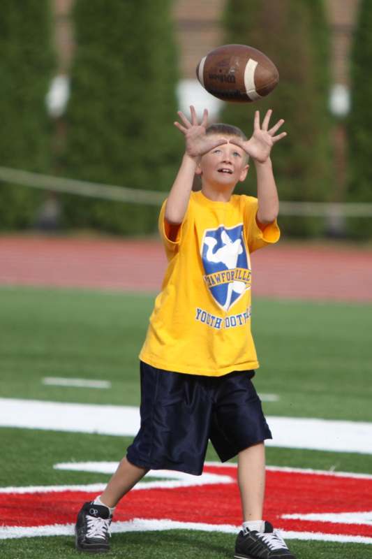 a boy catching a football