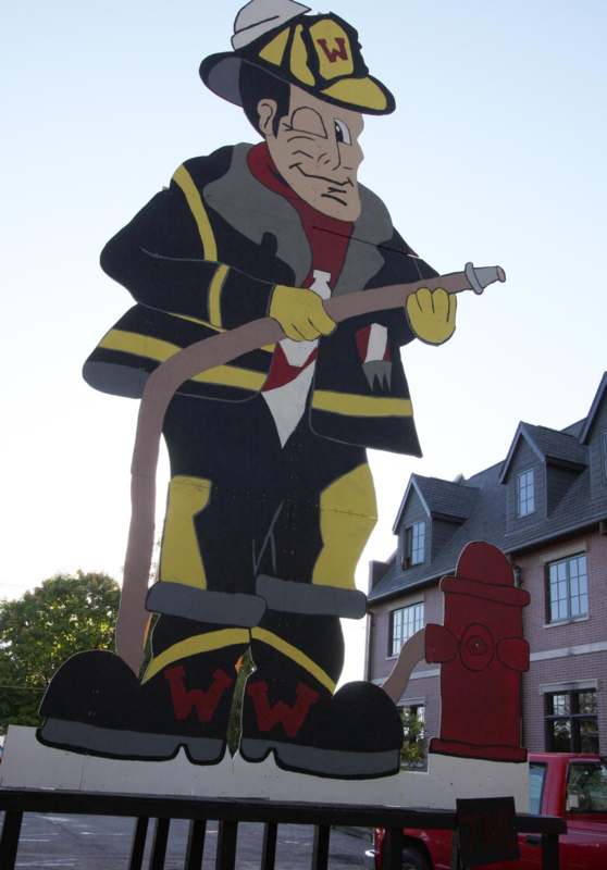 a large firefighter cut out of a cardboard cutout