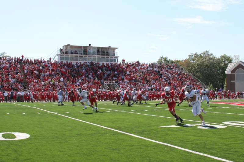 a football game with a crowd watching