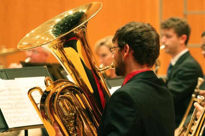 a man playing a tuba