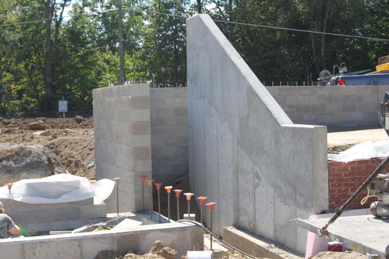 a construction site with a concrete wall