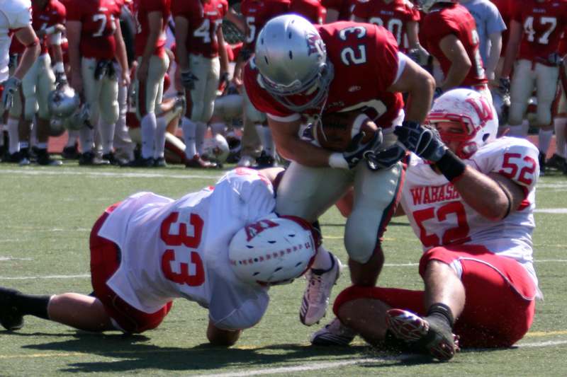 a football player being tackled by another football player