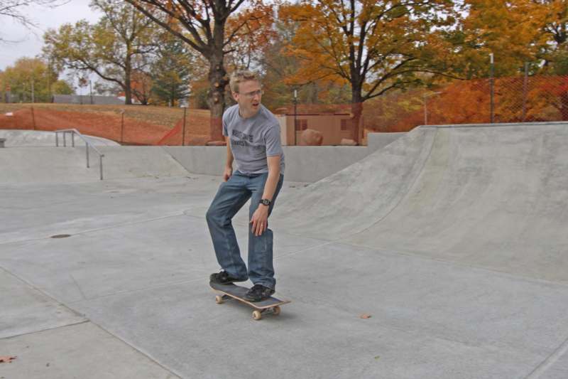 a man riding a skateboard at a skate park
