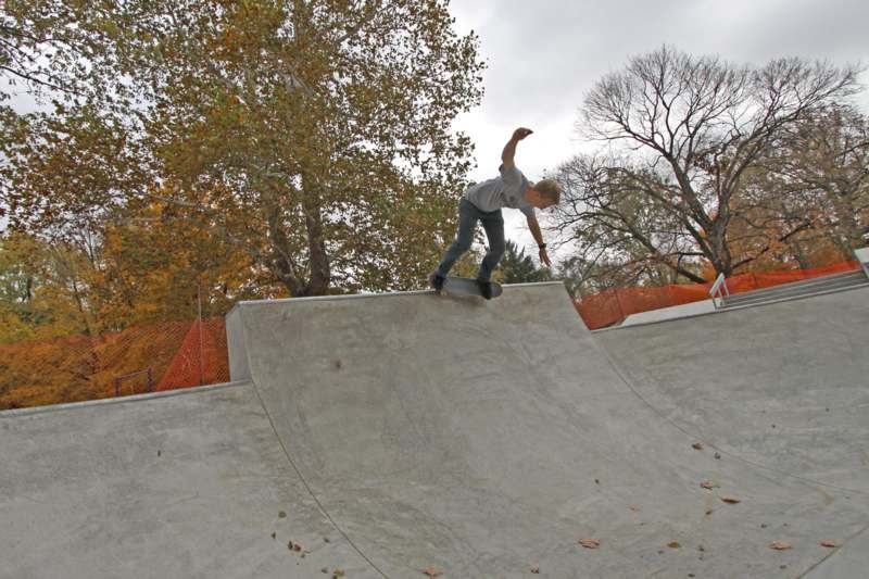 a boy on a skateboard on a ramp