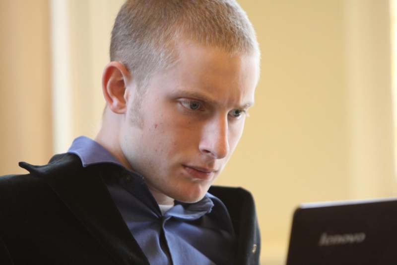 a man looking at a computer