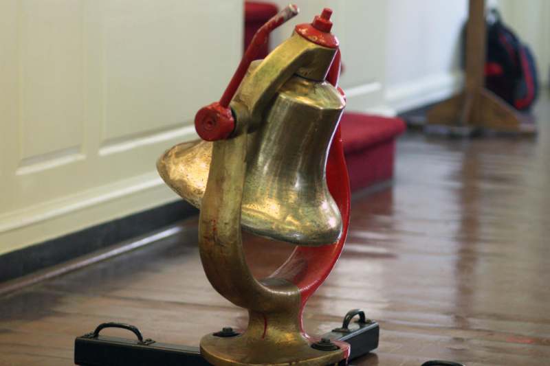 a bell on a stand
