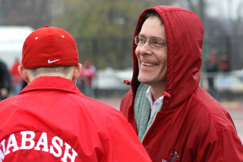 a man in red jacket and hat smiling