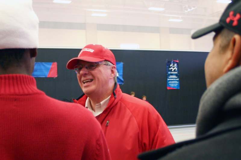 a man wearing a red cap and a red jacket