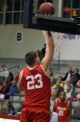 a basketball player dunking a basketball hoop