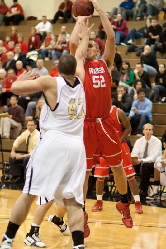 a basketball player shooting a ball