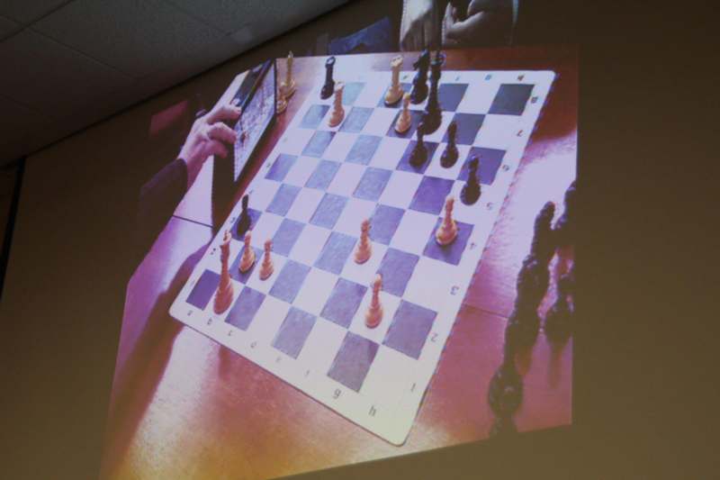 a person playing chess on a table