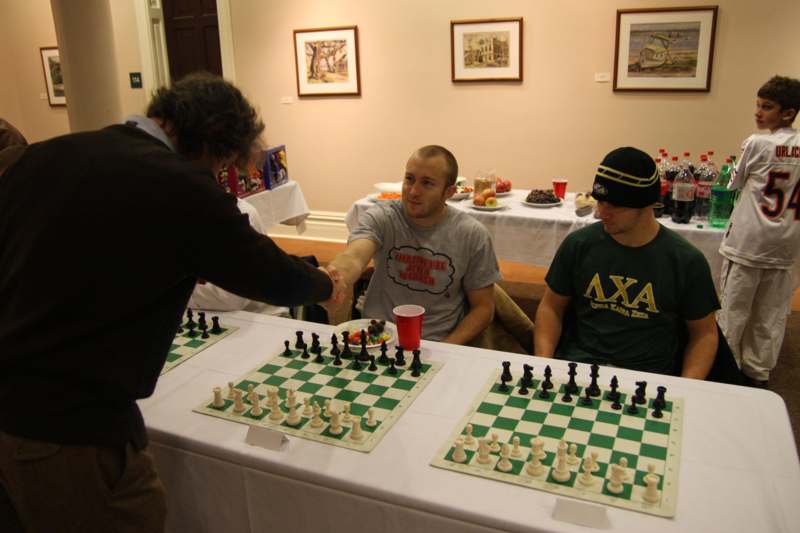 a group of men playing chess