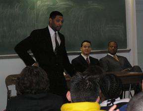 a man standing in front of a classroom