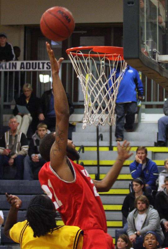a basketball player dunking a basketball hoop