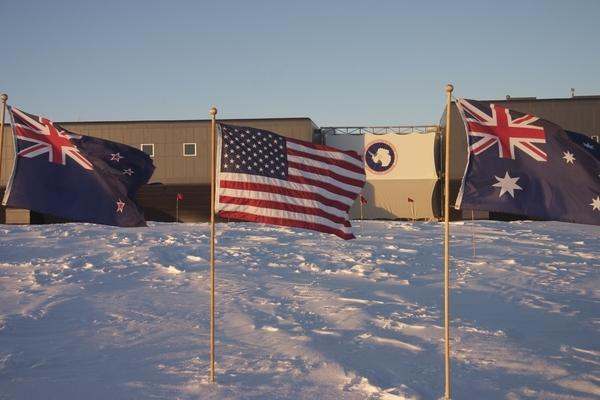 several flags in the snow