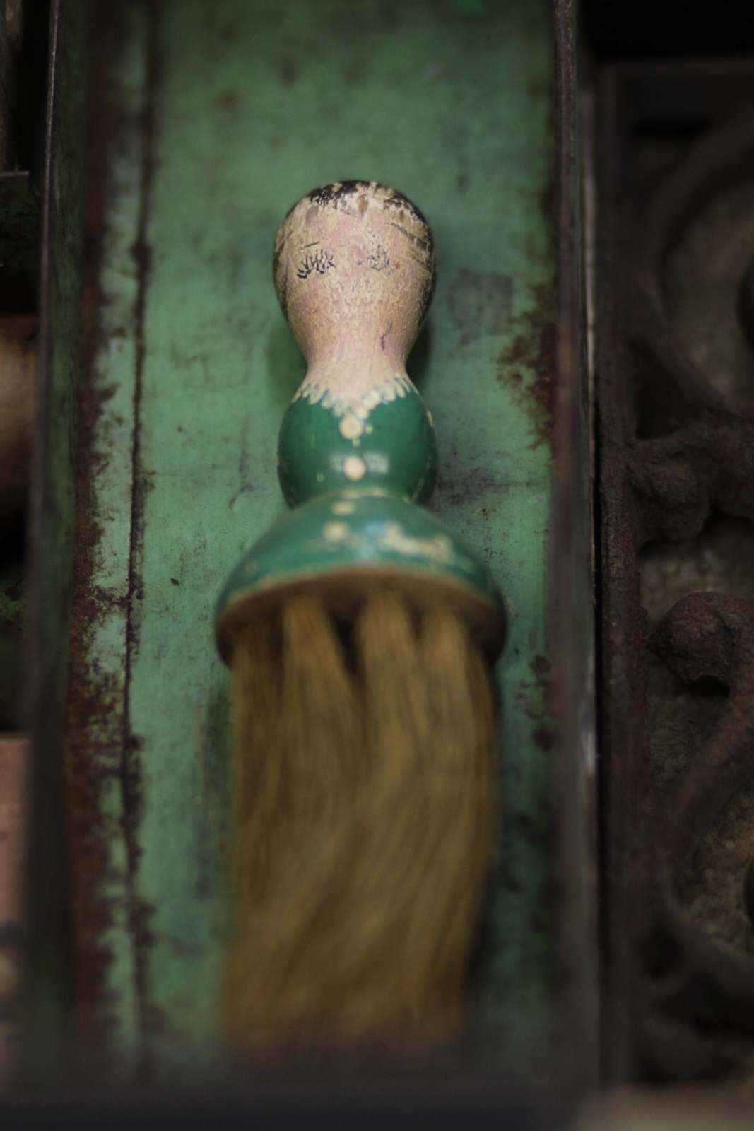 a green and white object with a face on it