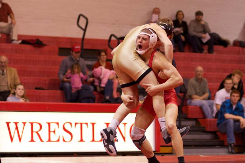 a man wrestling another man in a wrestling match