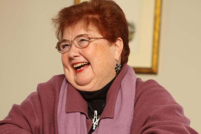 a woman laughing with glasses