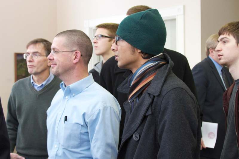 a group of men standing in a line
