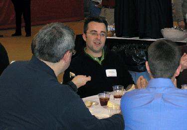 a group of men sitting at a table