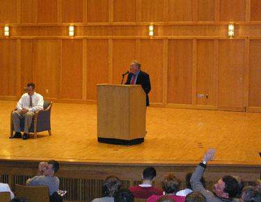 a man standing at a podium