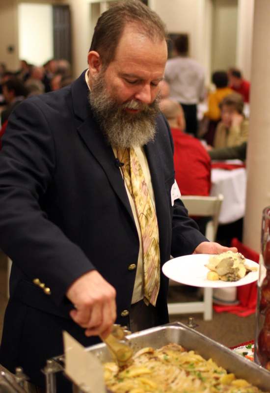 a man holding a plate of food
