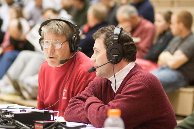 a group of men wearing headsets