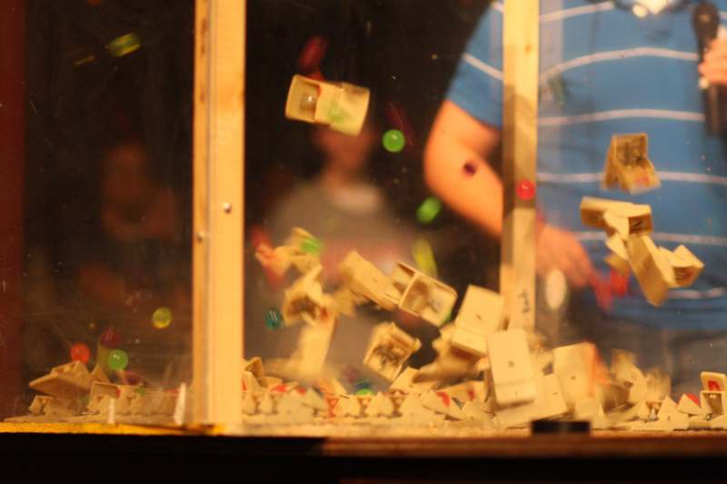 a group of objects falling in a glass case