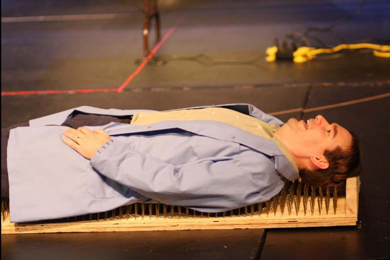 a man lying on a mat