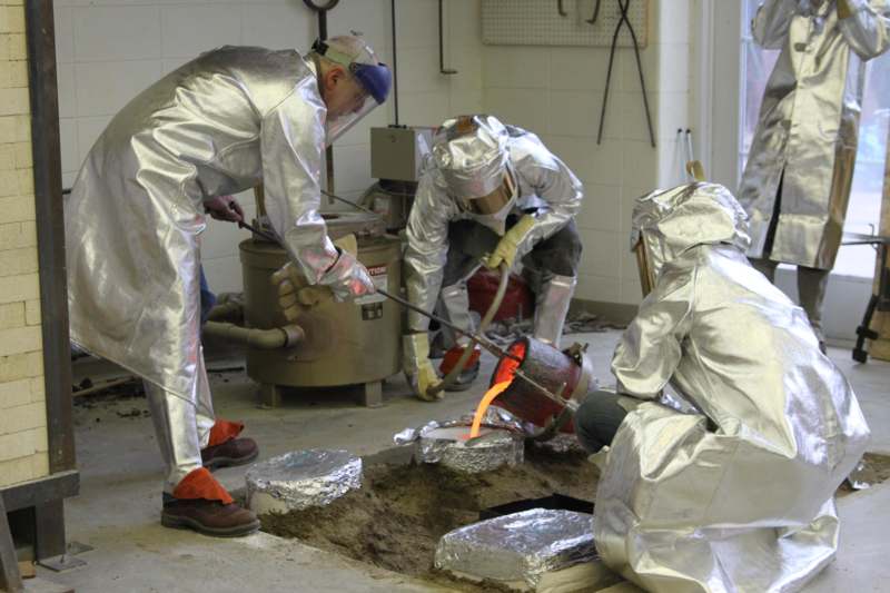 a group of people in protective gear working