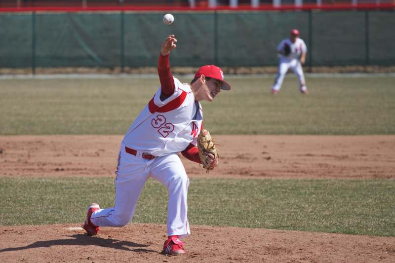 a baseball player throwing a ball