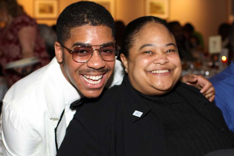 a man and woman smiling at camera