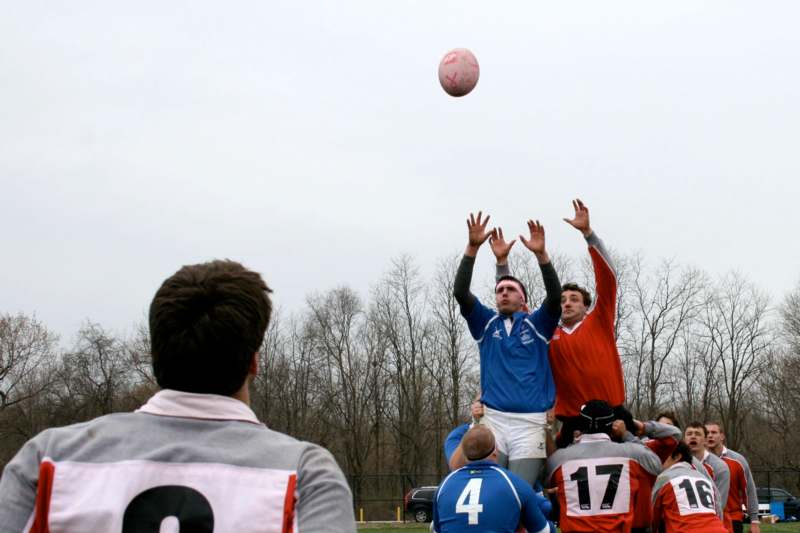 a group of people playing a game of rugby