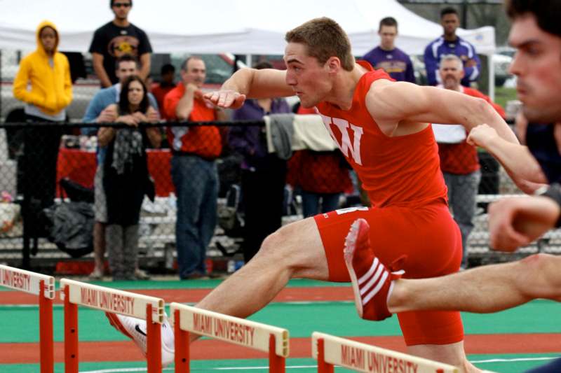 a man running a hurdle