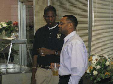 a man talking to another man