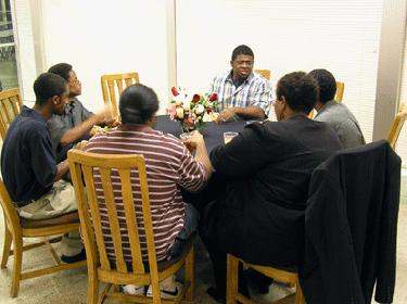 a group of people sitting around a table