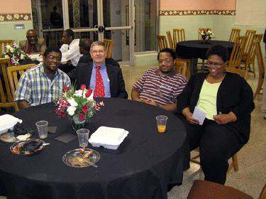 a group of people sitting around a round table